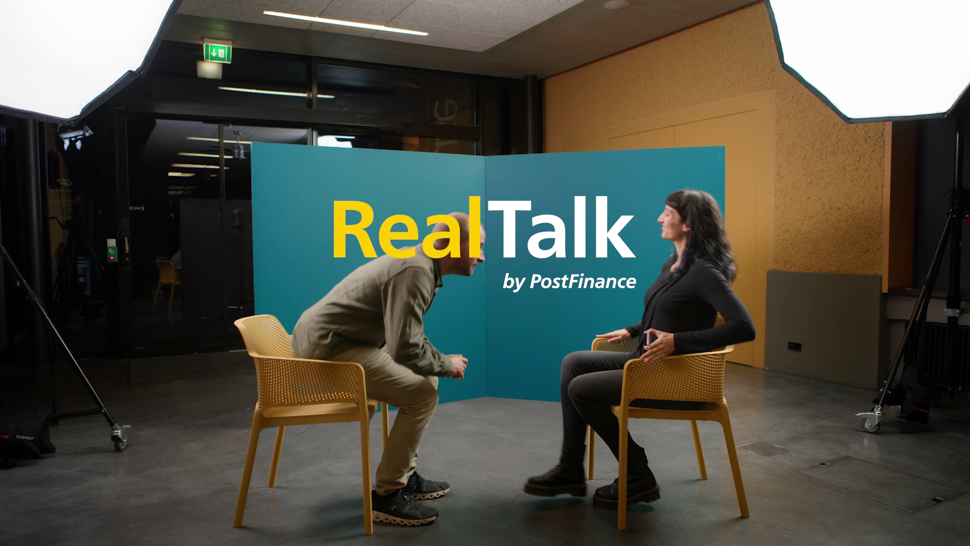 Two people on chairs talking to each other with the caption "Real talk"